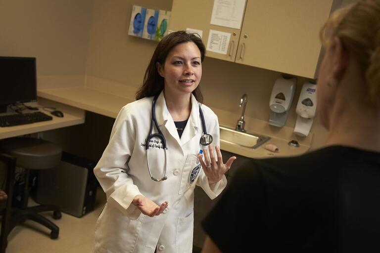 Employee speaks to a doctor